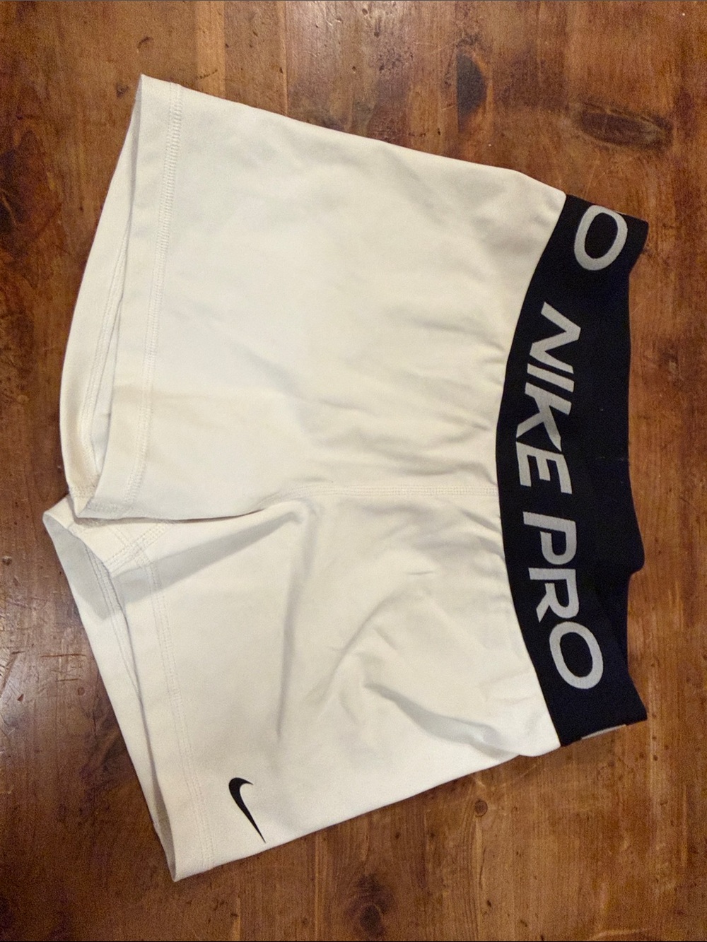 Nike Women's White Athletic Shorts with Black Branded Waistband
